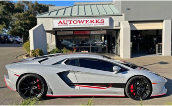 Lamborghini Aventador in front of shop