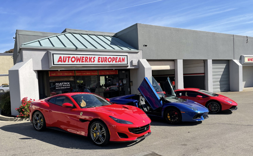 Ferrari and Lamborghinis in front of shop
